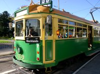 yellow and green Melbourne tram